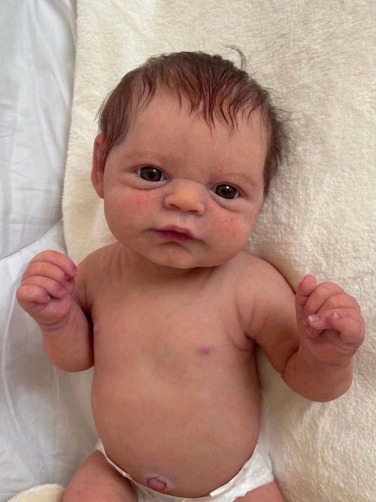 Muñeco Reborn Realista Ryan Ojos abiertos  Niño  50cm y 1.700 kg + Pack Premium