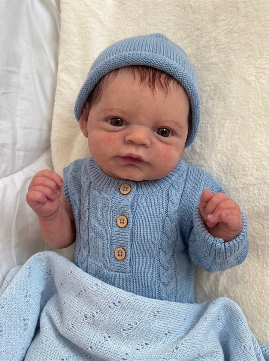 Muñeco Reborn Realista Ryan Ojos abiertos  Niño  50cm y 1.700 kg + Pack Premium